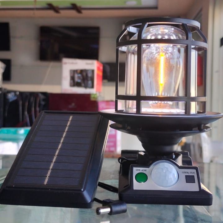 The JD-1578A Solar Sensor Light is an outdoor wall lamp featuring a built-in motion sensor, dual solar charging capability, and adjustable warm/white LED lighting modes.