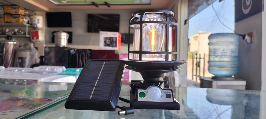 The JD-1578A Solar Sensor Light is an outdoor wall lamp featuring a built-in motion sensor, dual solar charging capability, and adjustable warm/white LED lighting modes.
