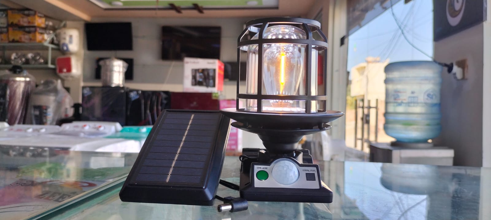 The JD-1578A Solar Sensor Light is an outdoor wall lamp featuring a built-in motion sensor, dual solar charging capability, and adjustable warm/white LED lighting modes.